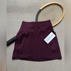 ⛳️🛼🏓Athleta Skort. “Salutation” in Spiced Cabernet. Never worn xs. New with tag.